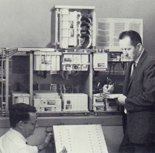 Command Module communication and data system undergoes a carefully controlled electronic laboratory system test at Collins Radio, Cedar Rapids.